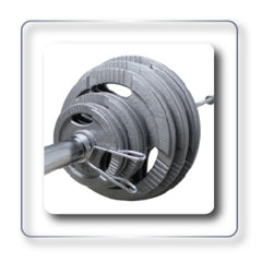 Olympic weight plates in various colors, arranged by weight, highlighting the organization of a fitness facility.
