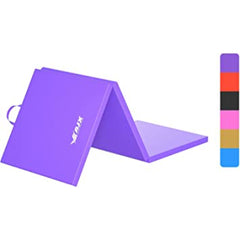 A vibrant purple yoga mat rolled out on a wooden floor, ready for a workout