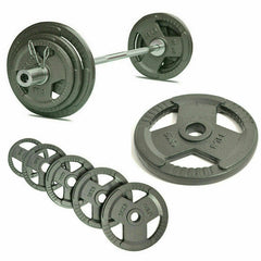 A detailed shot of an Olympic weight plate showing the weight specifications, with a blurred gym background.